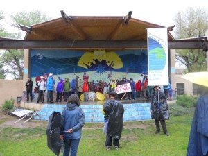 Great March for Climate Action arrives in the down pouring desert rain of Taos, NM.