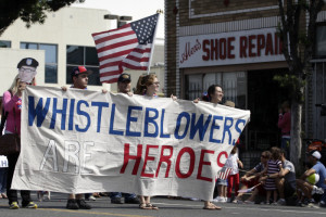 Supporters of whistleblowers march in Santa Monica's seventh annual Fourth of July parade in Santa Monica, California