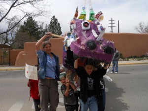 Schoolkids from Penasco joined the Community Parade during the Global Climate Convergence, bringing along the recycled plastic dragon they built!