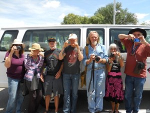 We are the media! Love-In-Action Taos proclaims, holding up cameras for the camera. We are the news: both the subject and reporters!