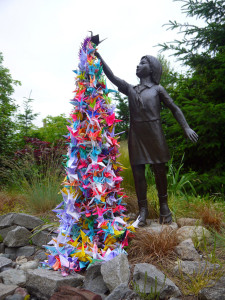 Sadako statue with paper cranes in Japan.